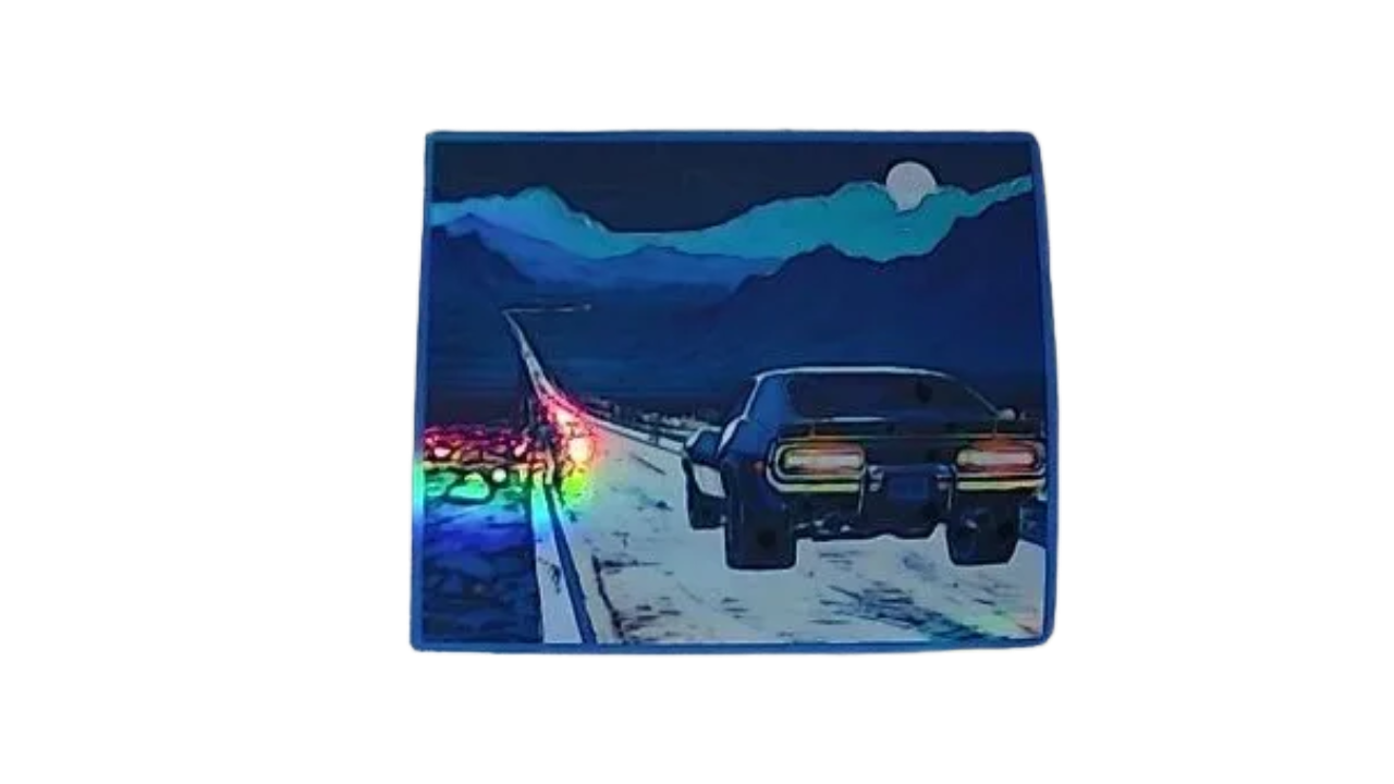 Car on a desert road with mountains at night holographic magnet that is thin flexible