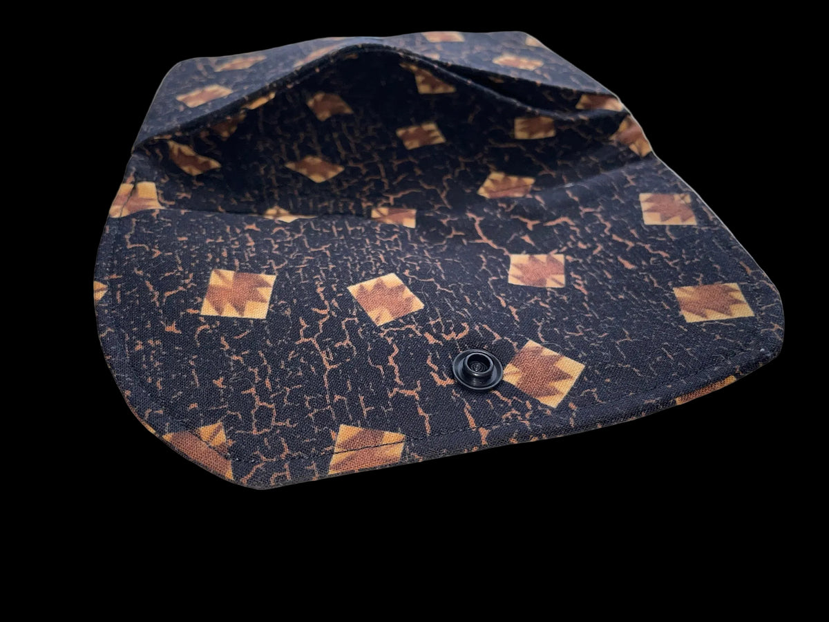 Small pouch with a patterned design on a surface