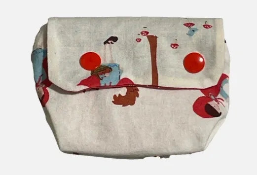 Fabric pouch with cartoon designs on a white background