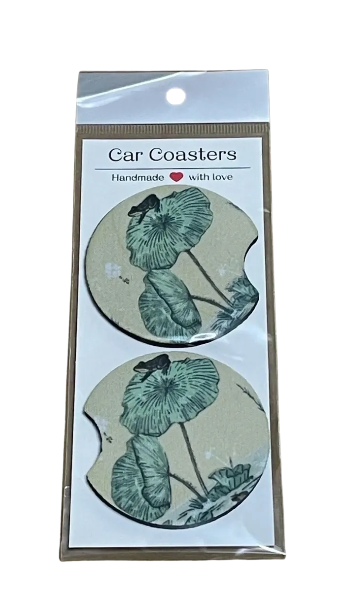 Pack of car coasters with frog design in packaging on a white background