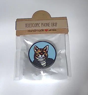 Telescopic phone grip with a cat design on a white background
