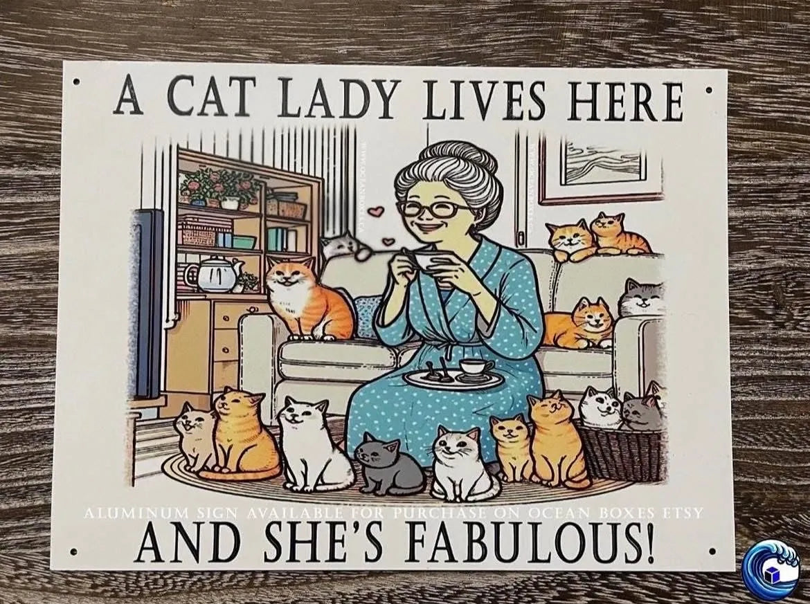 Sign of Cartoon of a woman surrounded by cats with text 'A cat lady lives here and she's fabulous!' on a wooden surface.