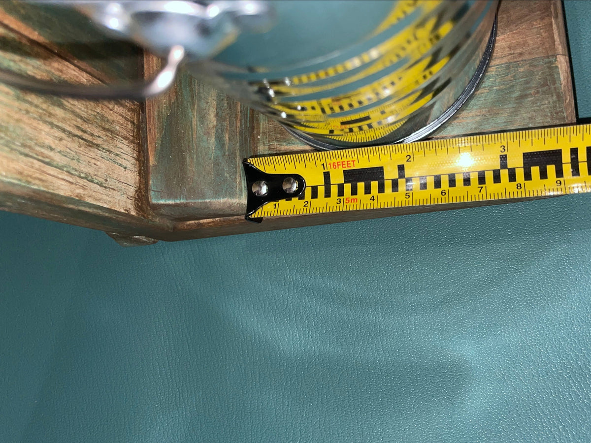 Yellow measuring tape on a textured blue surface