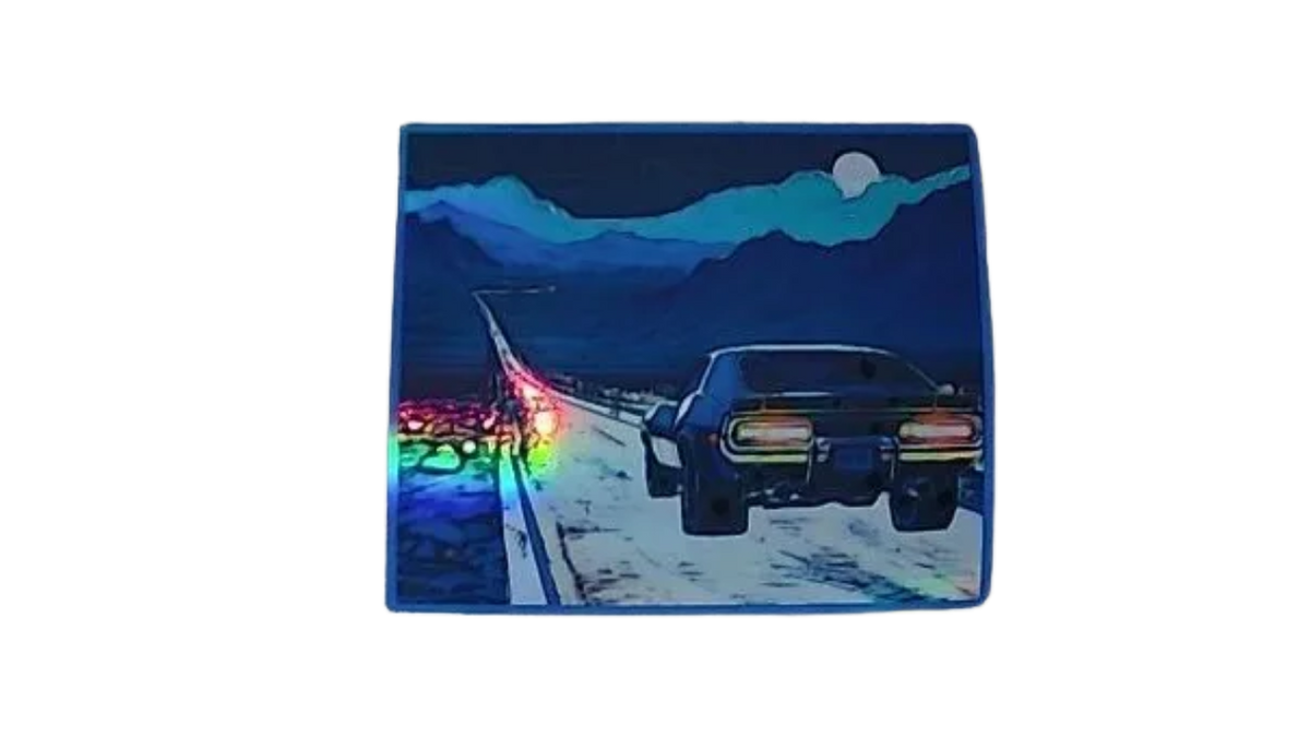 Car on a desert road with mountains at night holographic magnet that is thin flexible