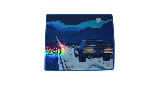 Car on a desert road with mountains at night holographic magnet that is thin flexible