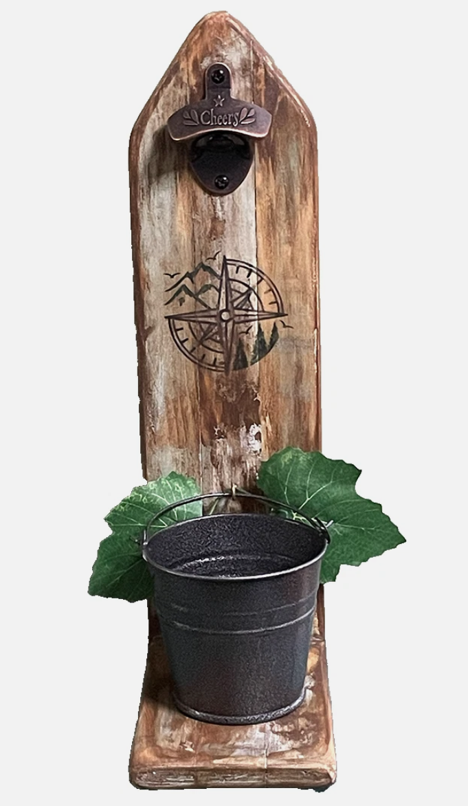 Wooden bottle opener with metal bucket and green leaves on a white background